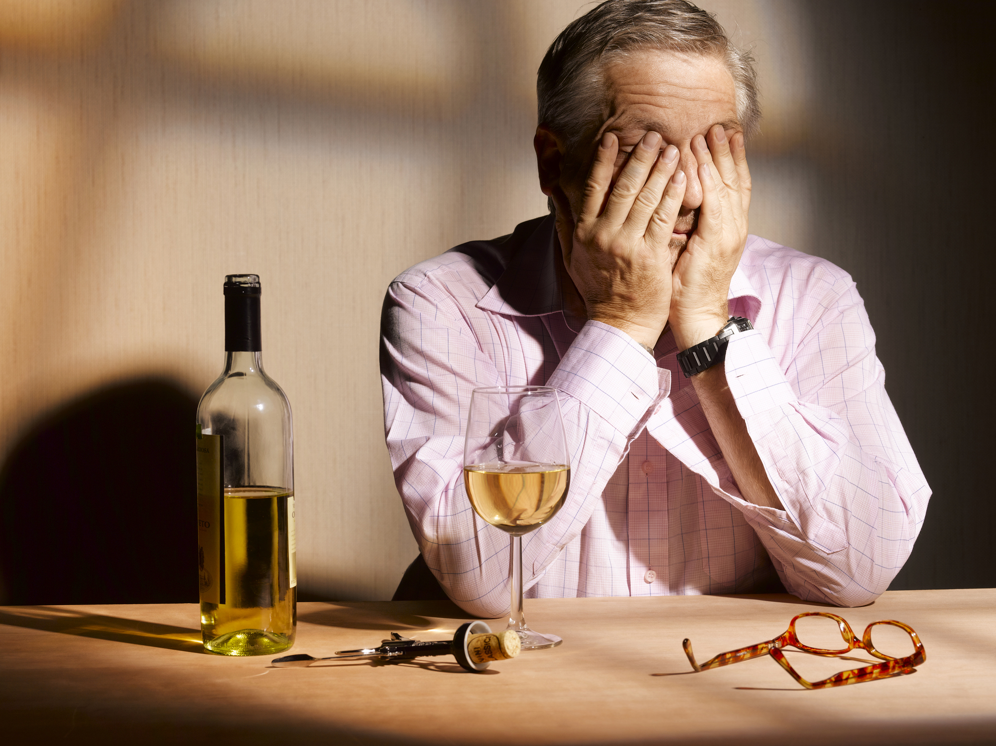 exhausted man with wine
